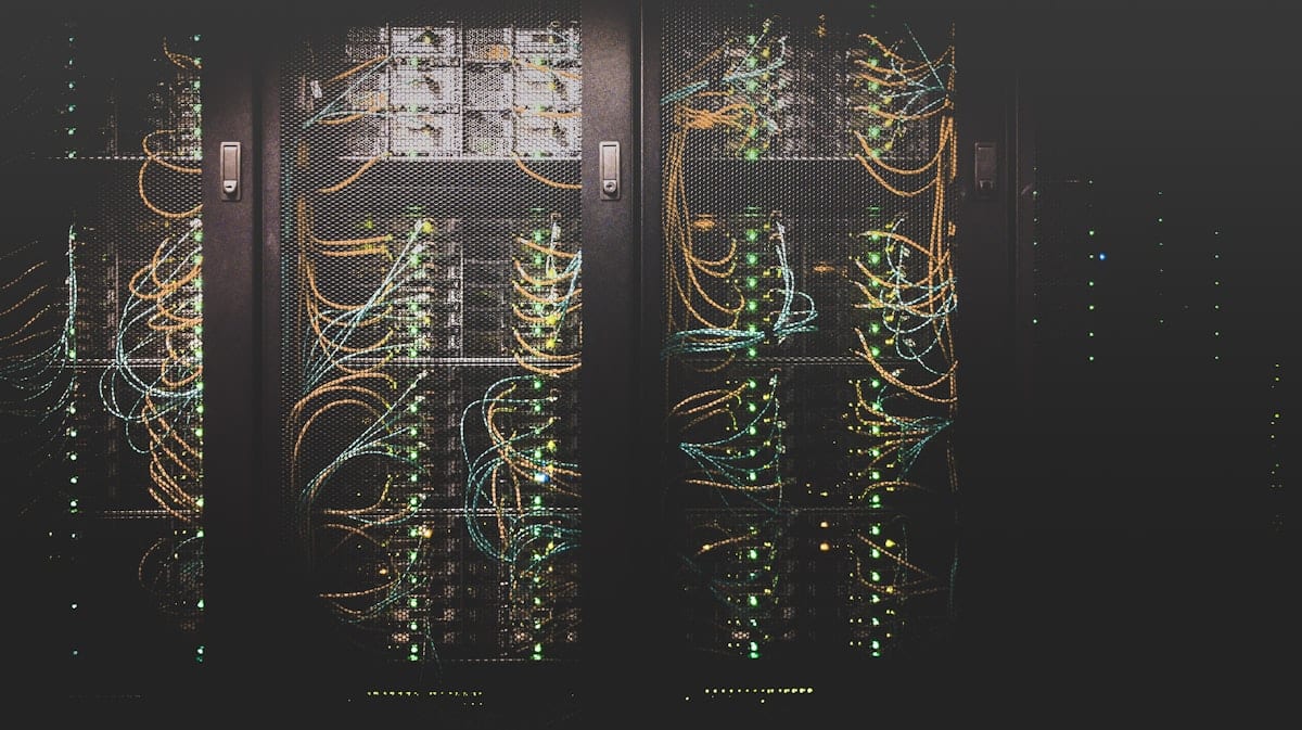 Server racks and authorisation documents — backdrop for the resources hub